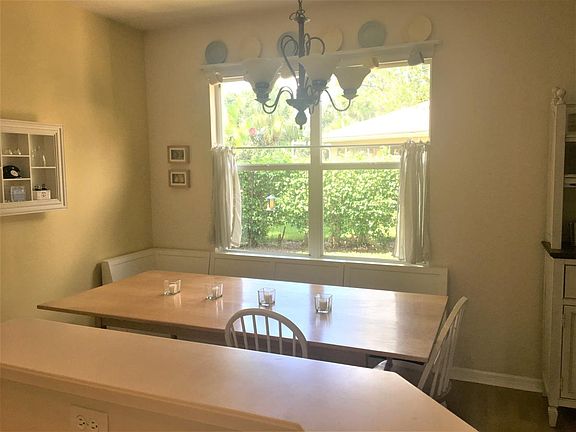 Dining area with half booth and book nook