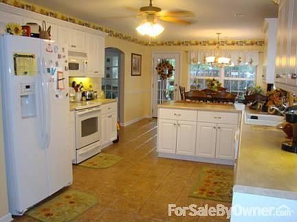 EAT IN KITCHEN : BRIGHT SUNNY KITCHEN, UPGRADED APPLIANCES, TILE ON WALLS, LIGHTS UNDER CABINETS