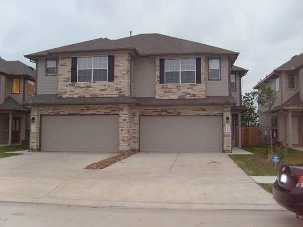 Street view, house is on the right. 2 car garage and space for 2 cars in driveway