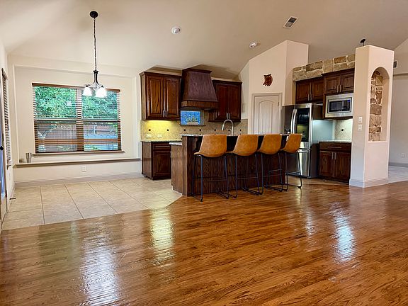 Beautiful accent walls, tile and real wood floors.