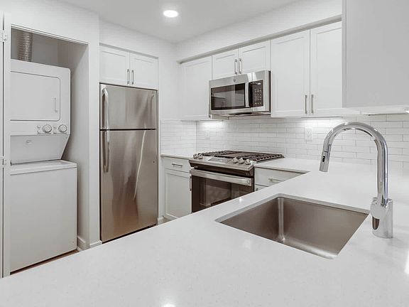 Kitchen with Stainless Steel Appliances and In-home Washer and Dryer