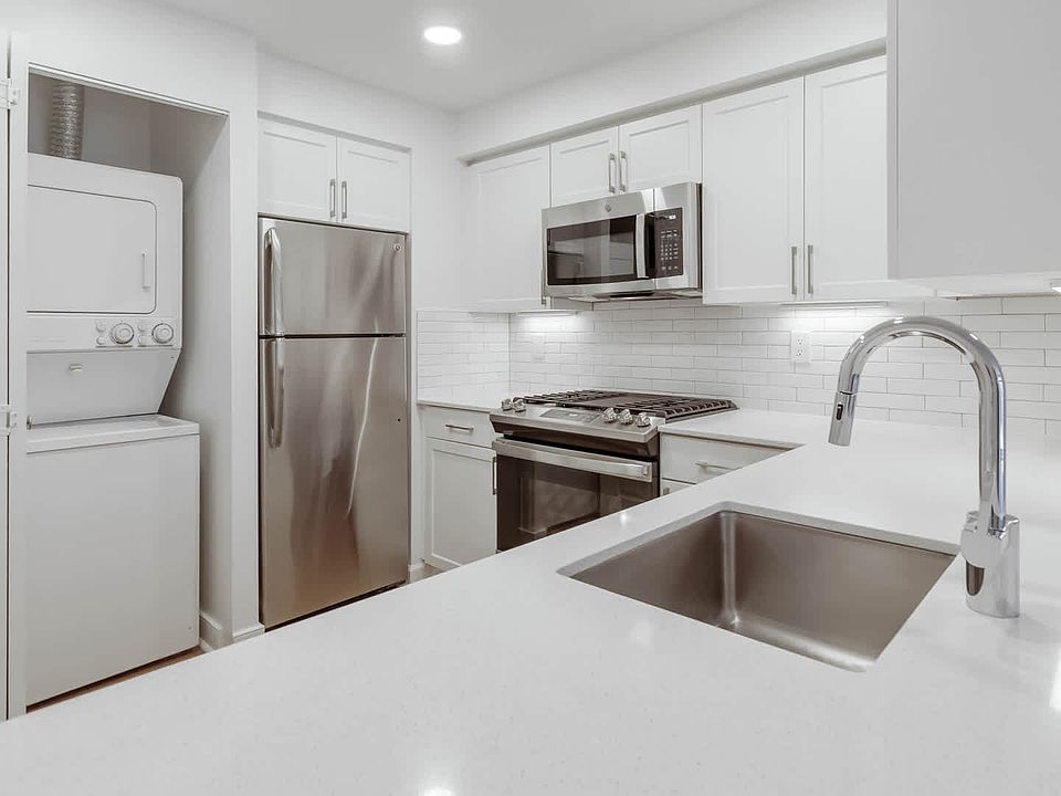 Kitchen with Stainless Steel Appliances and In-home Washer and Dryer