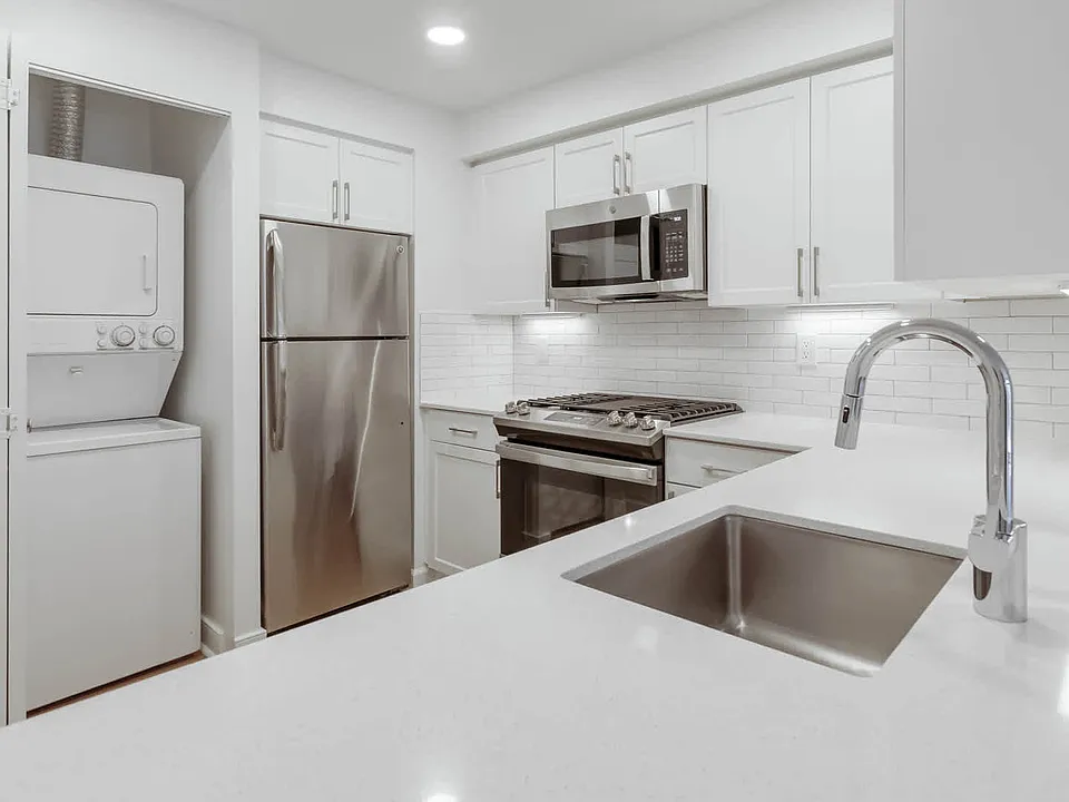 Kitchen with Stainless Steel Appliances and In-home Washer and Dryer