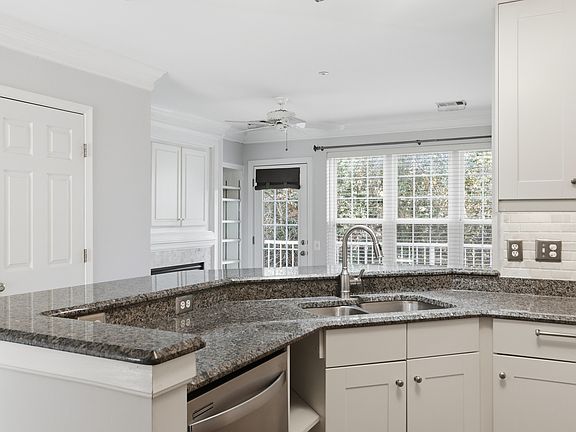 Nice view from kitchen to living/fireplace room with access to balcony.