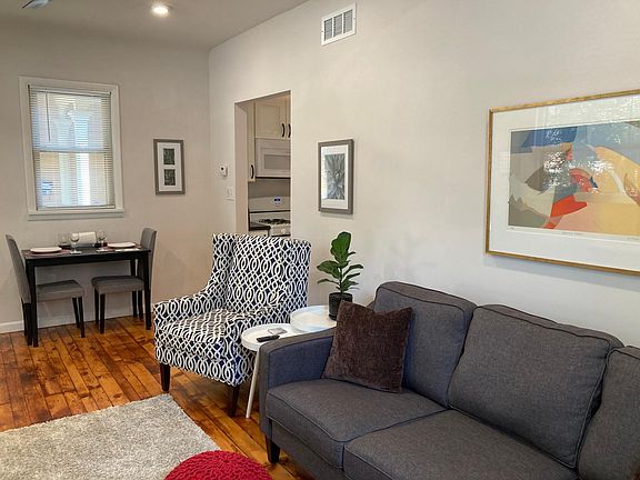 Furnished living room with dining nook.