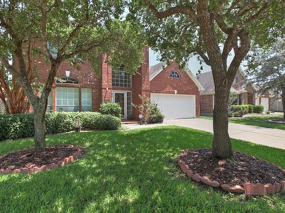 MATURE LANDSCAPING AND AN UPDATED SPRINKLER SYSTEM MAKES THIS YARD A BREEZE TO MAINTAIN
