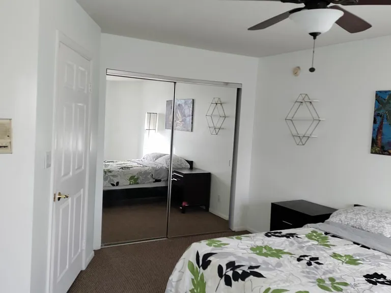 Upstairs front bedroom with attached full bathroom.