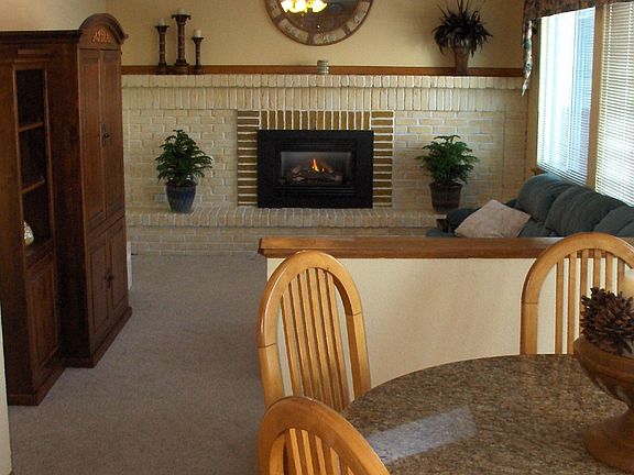 Familyroom with updated fireplace & windows!