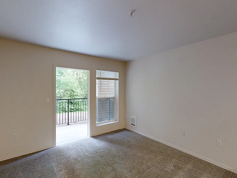 Apartment Living Room with Carpet Floor and Patio/Balcony.
