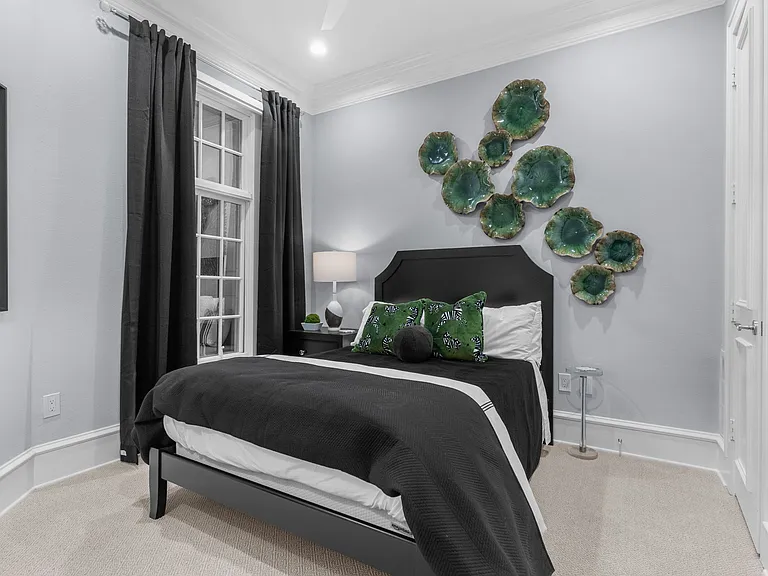 Serene first-floor bedroom with bold modern accents and designer details.