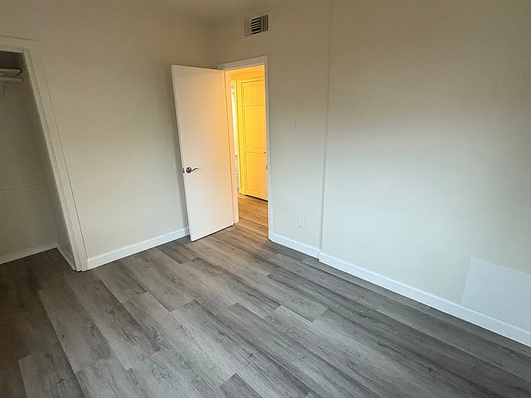 Right side bedroom, looking back at entry doorway. Closet just in view on the left