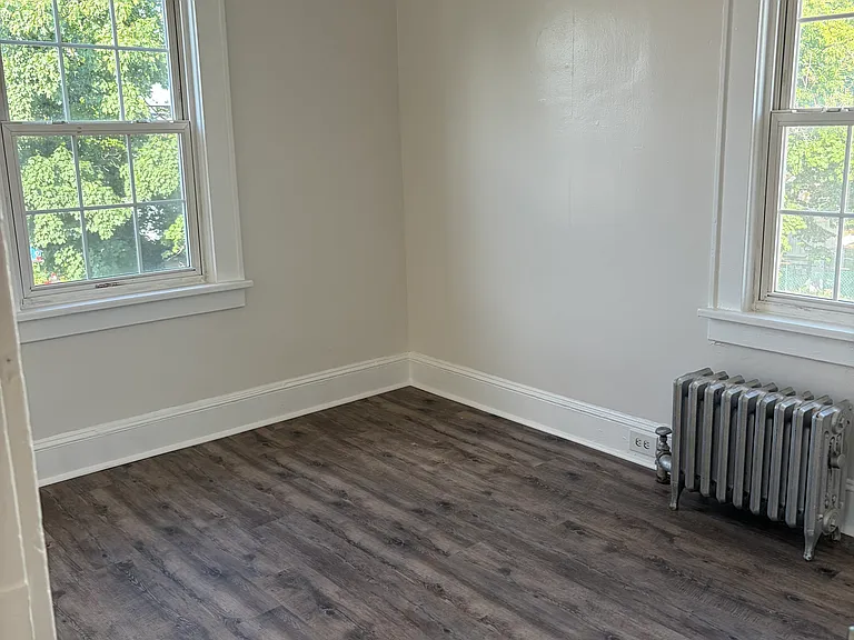 Bedroom one. Fresh paint and hardwood floors