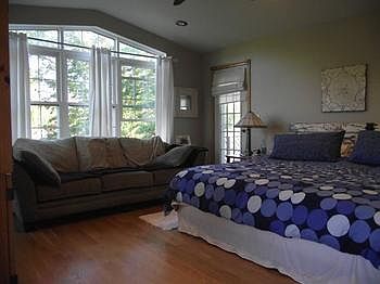 The master has vaulted ceilings, a door to it's own deck, hardwood floors, WIC, full bath and room for a sitting/ reading area.