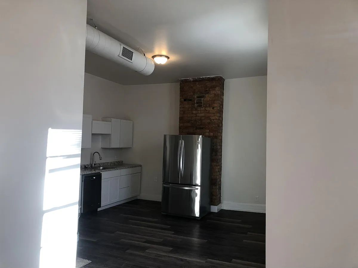 Living room into eat in kitchen - 225 Gilman Ave #2