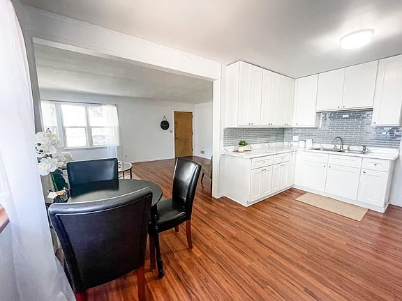 Small eat-in kitchen opening to the living room! Great natural light throughout!
