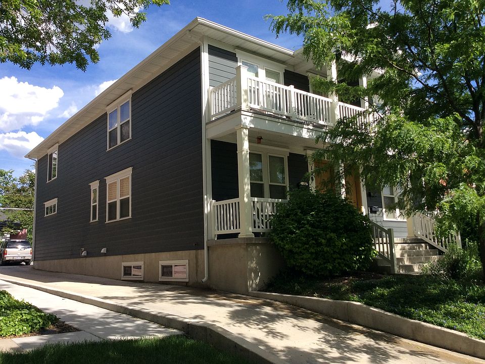 Side view of the building driveway leads to back yard and parking area