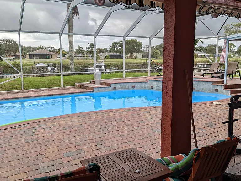 Poolside covered seating area where you can take in the views of the sunrise, sunset, enjoy your morning coffee or supervise pool activities comfortably.