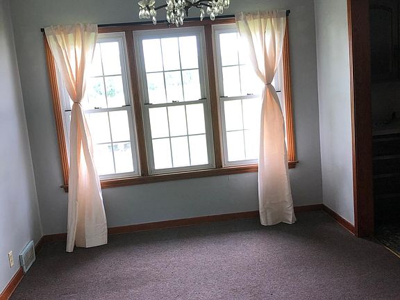 Dining room with fresh paint and chandelier