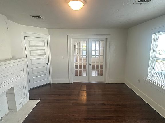 living room with French doors to bedroom