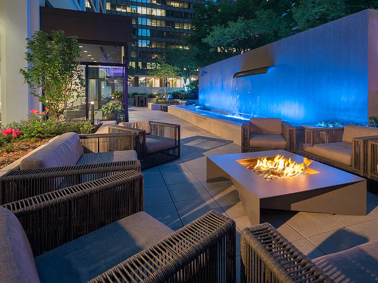 Enjoy the ambiance of our cozy fire pits and relaxing waterfall