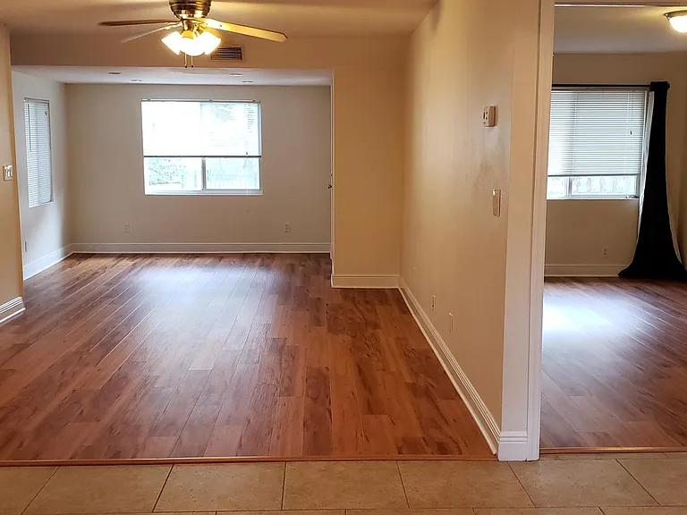 Living room and looking into third bedroom
