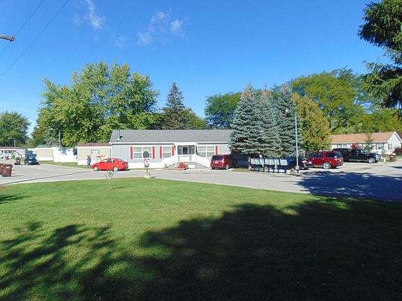 Looking East from your front deck you will notice the lovely grounds and Community that this home is located in.