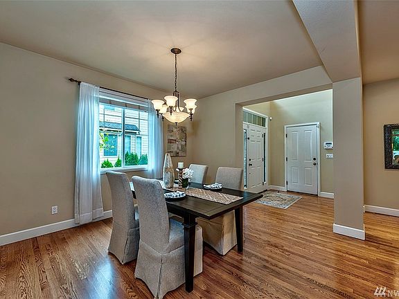 Step into the foyer and enjoy your first look at the formal dining room. The open space could accommodate a much larger table. 