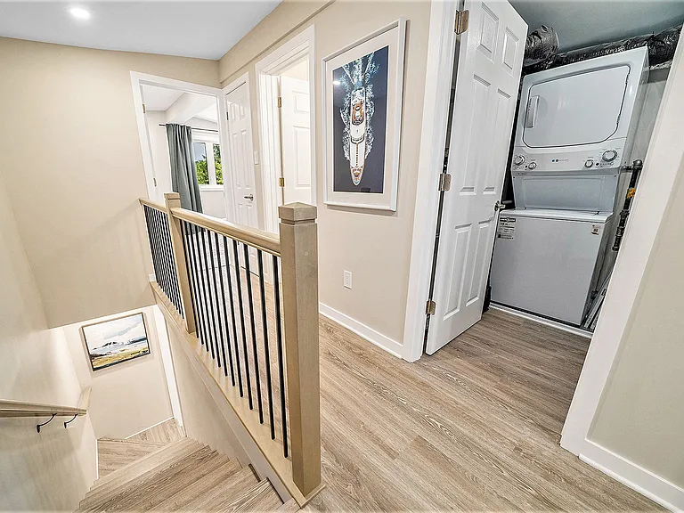 In-unit laundry facilities featuring a stackable washer and dryer in our Ottawa furnished rental.