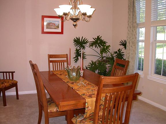 Formal and elegant dining room offers lots of light and great crown molding! 