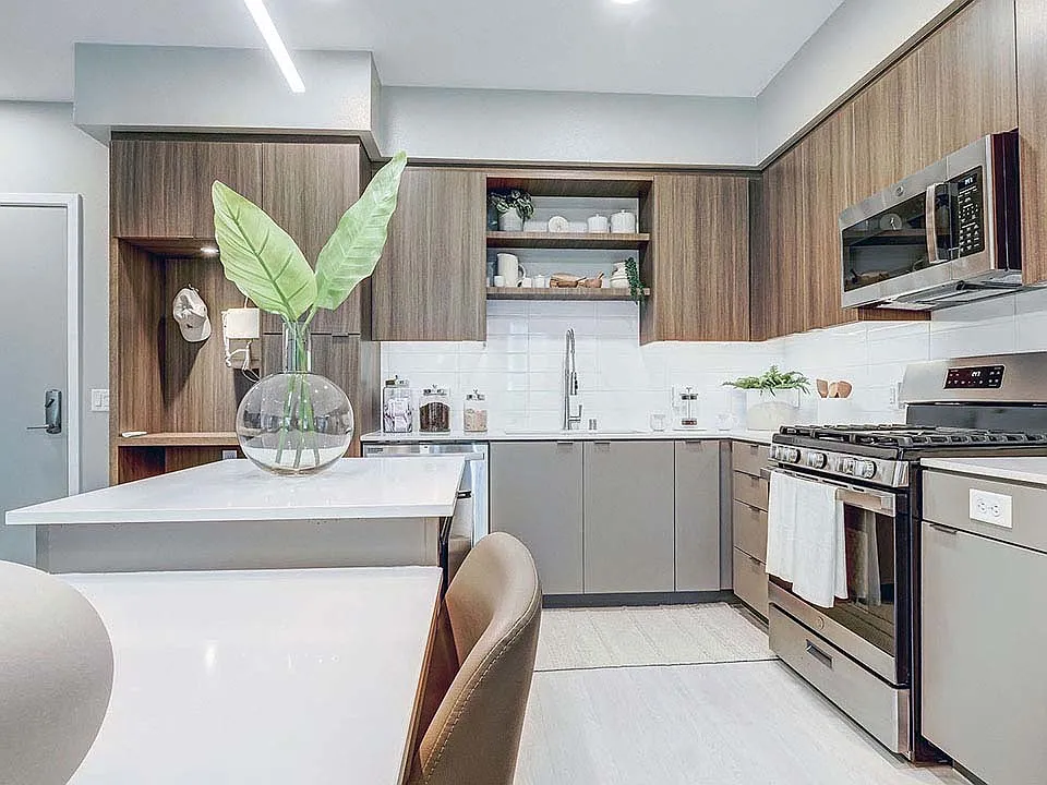 Griffis Platinum Triangle apartment kitchen with quartz countertops.