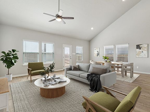 Virtually staged living room in the Fitzhugh floorplan at a Meritage Homes community.