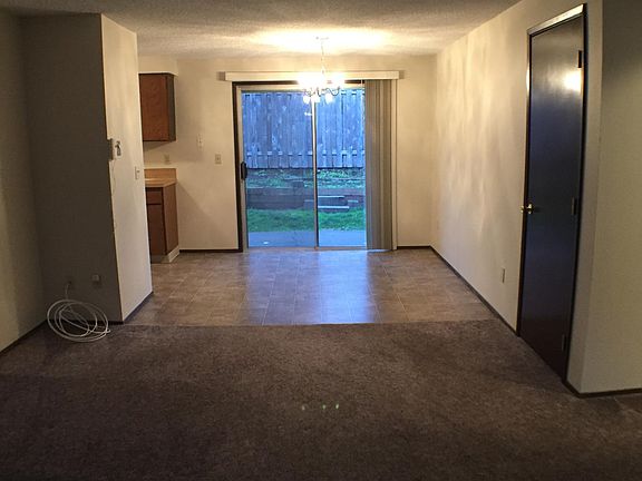 Great Room and Kitchen Nook. Slider door leads to the fenced yard. Closet to the right.