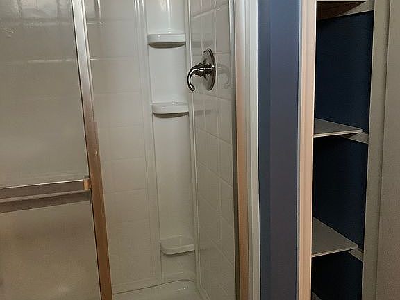 Basement bathrm linen closet