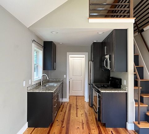 Kitchen with granite counters and storage