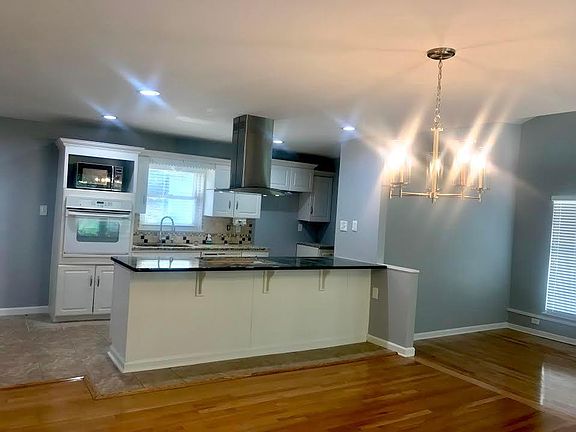 Kitchen, dining and living areas.