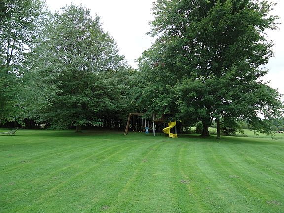 view of backyard and swingset