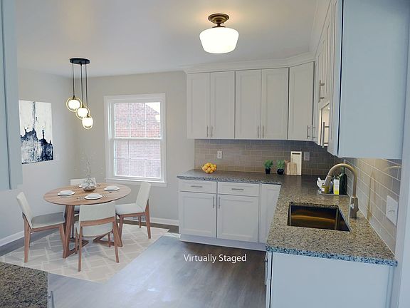 Kitchen with breakfast seating area - Virtually Staged