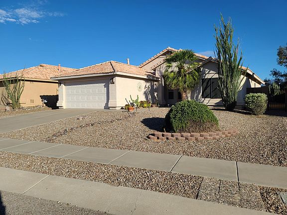 Front view from Mount Baldy Way with a view of the sidewalk and the fenced off side-yard