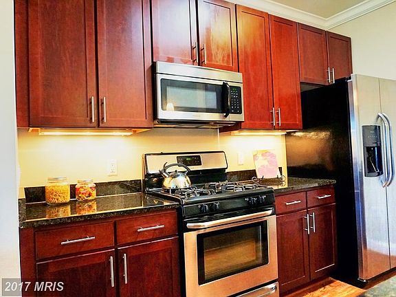 Custom Cabinets and Stainless Steel Appliances in Kitchen