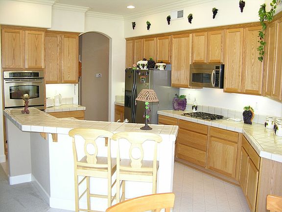 Spacious kitchen with tons of cabinetry for storage.