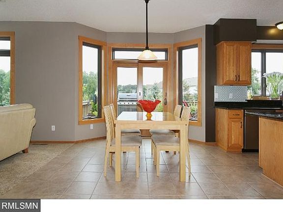 The kitchen also has plenty of room for a good size dinette table and a bayed sliding glass door to the deck overlooking the pool