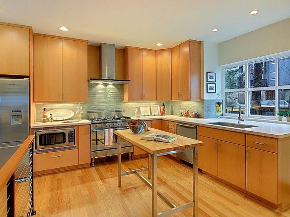 Open Flow Cook's Kitchen with High Performance European Stainless Appliance Suite Featuring Fisher &