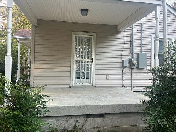 Side porch. Door opens to LR