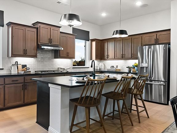 Westbury two-story floor plan featuring open first-floor living, a private study, covered patio, and