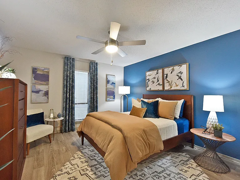 Bedroom with hardwood-style flooring