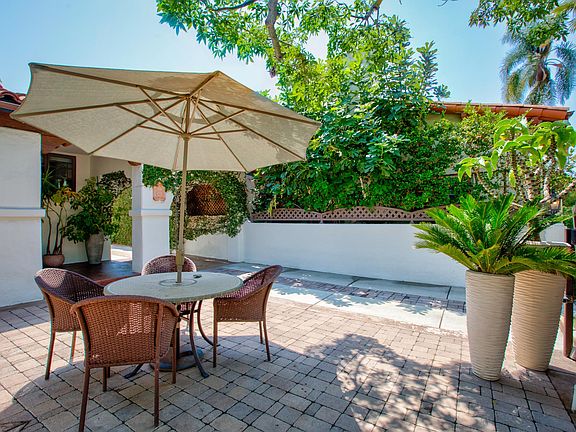 Outdoor dining area in private front courtyard.