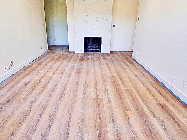 Unit #302 massive living room looking towards fireplace!