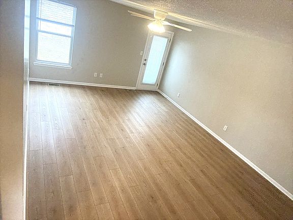 Bright and spacious living room with new flooring