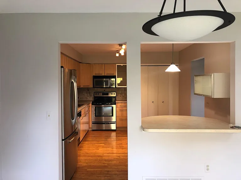 Spacious Kitchen with hardwood floors, upgraded cabinets and stainless steel appliances and breakfast nook