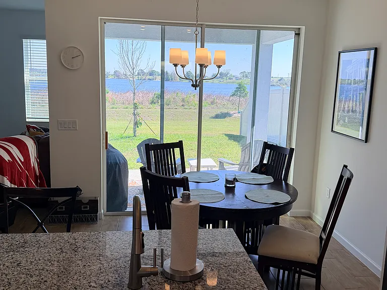 Breakfast room with lake view, 8 foot glass sliding doors.